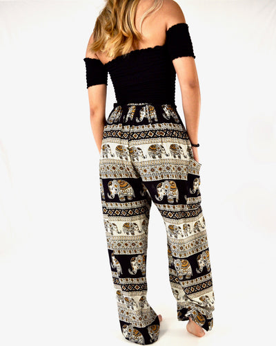 Rear-view aztec elephant pants in black with model and white background-full size image