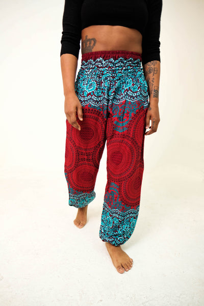 Front-view mandala elephant pants in red & teal with model and white background-halfsize image
