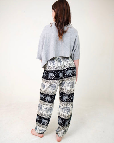 Rear-view chang thai elephant pants in black with model and white background-full size image