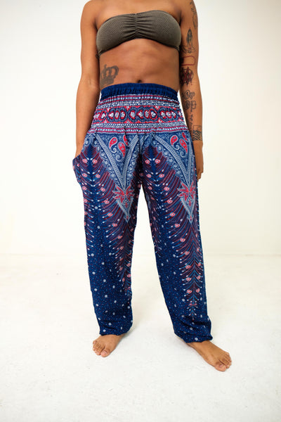 Front-view peacock elephant pants in purple with model and white background-fullsize image