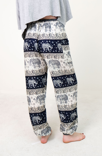 Rear-view chang thai elephant pants in navy with model and white background-half image